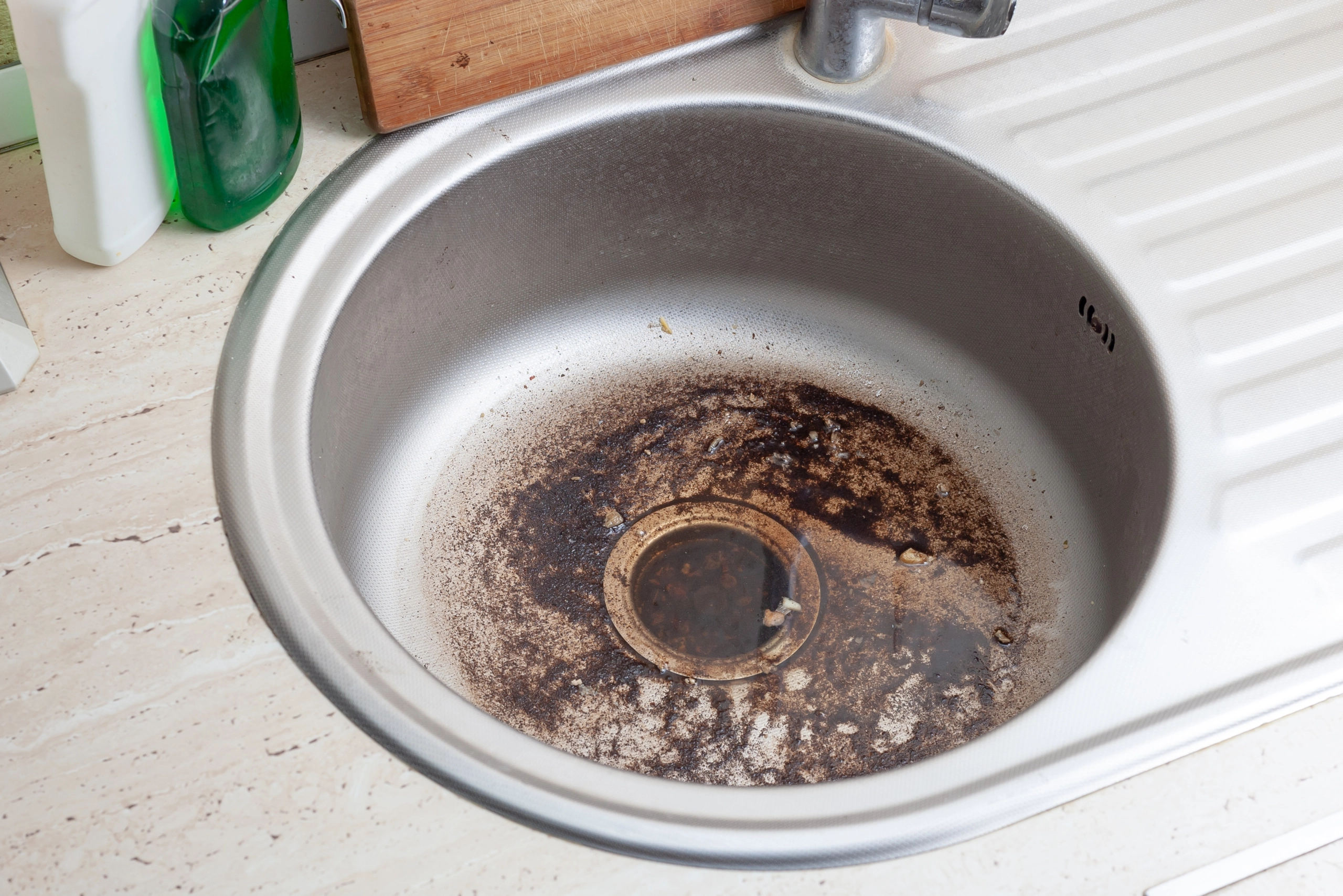 Dirty Sink at kitchen room. Clean a sink drain. unclog a kitchen sink without a disposal